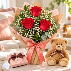 red roses and teddy bear and chocolates
